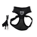 Black breathable pet harness with a leash on a white background